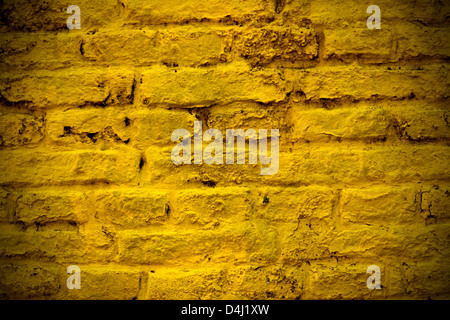 A yellow brick wall for background or texture usage Stock Photo