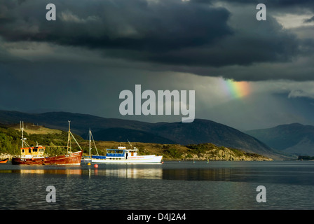 Storm clouds with rainbow over Highland mountains from Ullapool. Highlands, Scotland Stock Photo