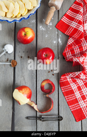 Apple pie ingredients on a raw, weathered wood background. Stock Photo