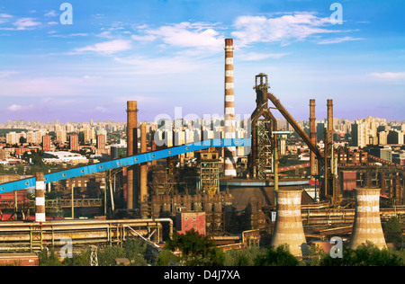 Landscape of construction power factories with big chimneys and modern buildings in background Stock Photo