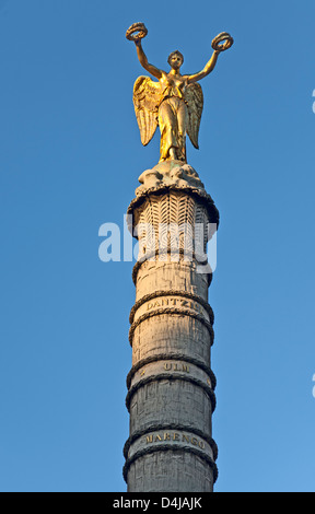 Gilded bronze statue of Victory on top of a tower on the Fontaine du Palmier,  Chatelet Square, Paris, France. Stock Photo