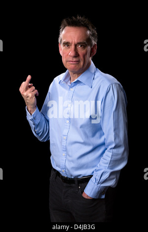 Angry Frowning Middle Age Business Man Giving One Finger Gesture on Black Background Stock Photo