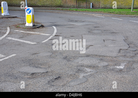 Potholes on Hithermoor Road, Stanwell Moor, Borough of Spelthorne, Surrey, England, United Kingdom Stock Photo