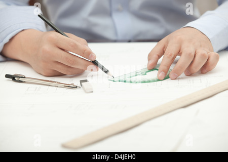 Hands male architect to make drawings using various line pencil and compass Stock Photo
