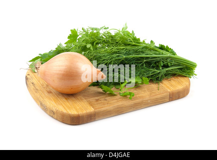 fresh dill, parsley and onion on a cutting board Stock Photo