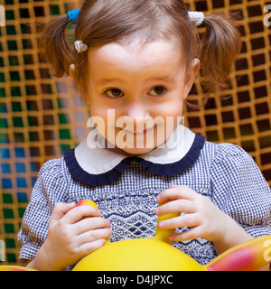 little happy girl on playground laughing Stock Photo