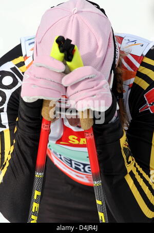 German cross-country skier Evi Sachenbacher-Stehle is exhausted after the women?s teamsprint event at the FIS Nordic World Ski Championships in Liberec, Czech Republic, 25 February 2009. Photo: Kay Nietfeld Stock Photo