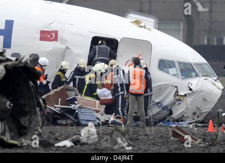 A dead body is recovered from the wreckage of the crashed airplane