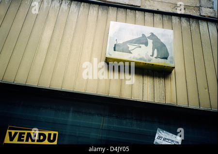 Old HMV dog and gramophone sign, Calais, France Stock Photo