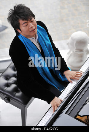 Chinese pianist Lang Lang performs music during the shooting of