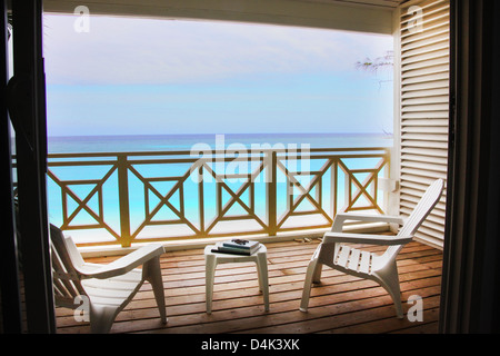 Empty chairs on wooden deck Stock Photo