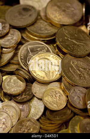 Old gold coins are melted down in a melting pot at the Heraeus gold ...