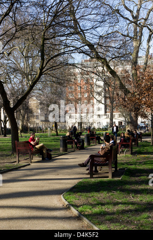 People relaxing in Tavistock Square gardens, Bloomsbury, London Stock ...