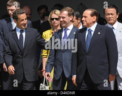 The Heads of Government of France, Nicolas Sarkozy (L-R), of Russia, Dmitry Medvedev, of Italy, Silvio Berlusconi, and of Japan, Taro Aso, arrive for the traditional family photograph in L?Aquila, Italy, 08 July 2009. This year?s G8 Summit will take place in L?Aquila from 08 til 10 July 2009. Photo: PEER GRIMM Stock Photo