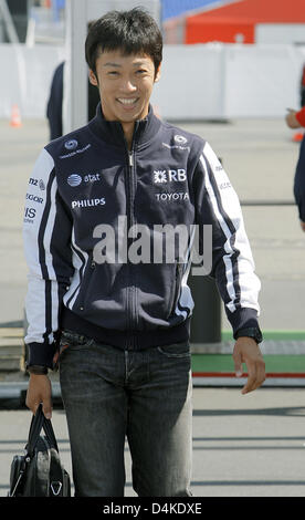 Japanese Formula One driver Kazuki Nakajima of Williams F1 arrives at the paddock at Nurburgring in Nuerburg, Germany, 09 July 2009. The Formula 1 Grand Prix of Germany will take place on 12 July. Photo: Jens Buettner Stock Photo