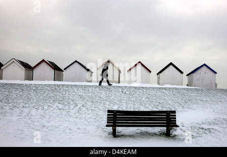 Snow at Beach Huts at Goring West Sussex UK Stock Photo