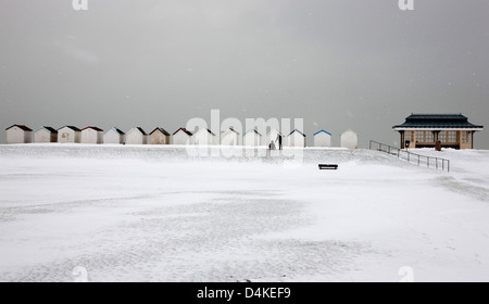 Snow at Beach Huts at Goring West Sussex UK Stock Photo