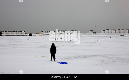 Snow at Beach Huts at Goring West Sussex UK Stock Photo