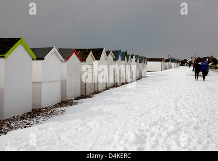 Snow at Beach Huts at Goring West Sussex UK Stock Photo