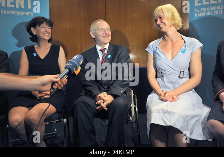 (L-R) Christa Thiel, president of the German Swimming Federation (DSV), German Minister of Interiors and Sports Wolfgang Schaeuble, and German swimming champion Britta Steffen smile during a presentation of Hamburg applying to host the 2013 FINA World Championships, at the FINA Swimming World Championships 2009 in Rome, Italy 18 July 2009. Photo: Bernd Thissen Stock Photo