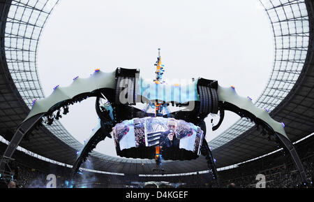 Bono, singer of Irish rock band U2, performs on stage during the first of two Germany concerts at the Olympic Stadium in Berlin, Germany, 18 July 2009. According to the organisers 90.000 fans flocked to the first concert of the ?360 Grad Tour? (360 degrees tour). Photo: RAINER JENSEN Stock Photo