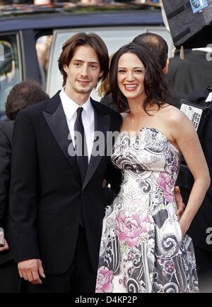 Italian actress and jury member Asia Argento and her husband Michele Civetta arrive for the gala screening of Pixar?s animation film ?Up? that runs out of competition and opens the 62nd Cannes Film Festival in Cannes, France, 13 May 2009. The film festival will take place from 13 til 24 May 2009. Photo: Hubert Boesl Stock Photo