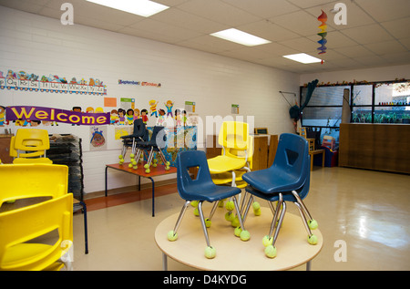 Interior of empty daycare room with children's art on walls Stock Photo