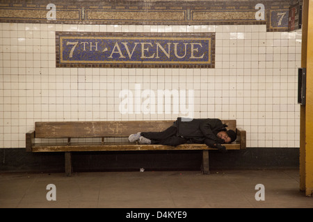 Tired man sleeps on a New York City subway train Stock Photo - Alamy