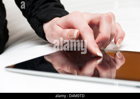 Young woman using ipad tablet computer. Stock Photo