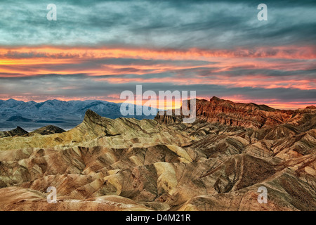 Spectacular sunset develops over Golden Canyon from Zabriskie Point and California's Death Valley National Park. Stock Photo