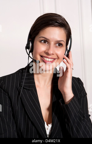 Businesswoman talking on headset Stock Photo
