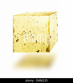 Gold nugget cube floating against white background. Stock Photo