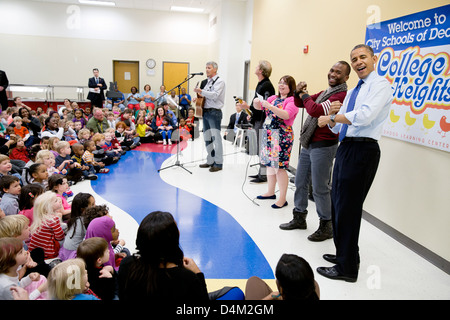 US President Barack Obama joins in a music program at the College Heights Early Childhood Learning Center February 14, 2013 in Decatur, GA. Stock Photo