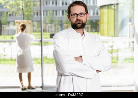 Doctor standing with arms crossed Stock Photo