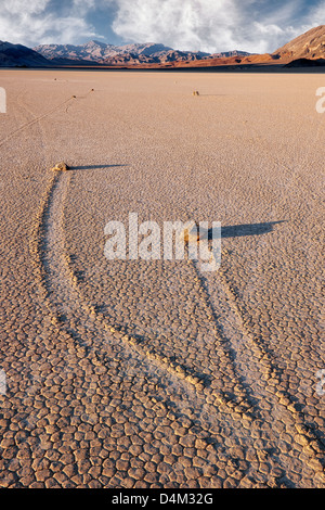 Moving rocks at The Racetrack leave trail imprints in the playa of California's Death Valley National Park. Stock Photo