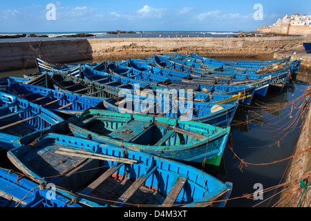 Blue boats docked in harbor Stock Photo