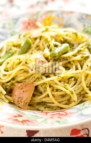 Spaghetti with Pesto Sauce served Italian style with green beans and potatoes Stock Photo
