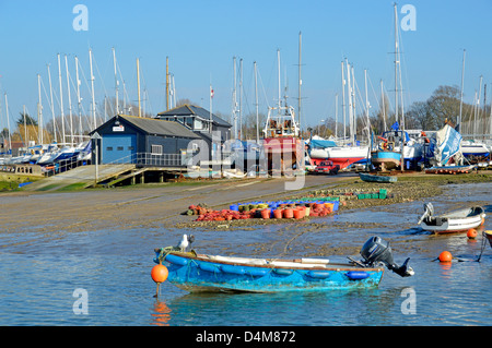 West Mersea lifeboat station buildings and boat yards landscape along the River Blackwater waterfront Mersea Island near Colchester Essex England UK Stock Photo
