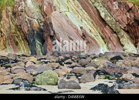 Rock and cliff faces with a varied geology at marloes sands beach pembrokeshire coast national park in late summer South West Wa Stock Photo