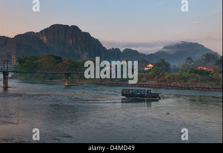 truck driving across the Nam Song River in Vang Vieng, Laos