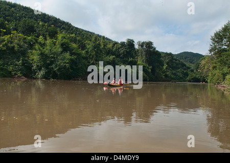 kayaking the Nam Ha River in Nam Ha Protected Area, Luang Nam Tha, Laos Stock Photo