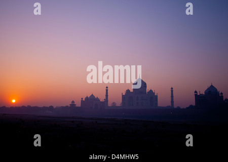 Sunrise over the Taj Mahal viewed from mehtab bagh park, across the dried up river Yamuna Stock Photo