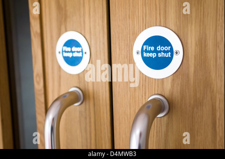 Fire door keep shut signs. Stock Photo