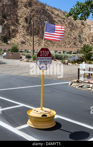 Sign Rv Stop A stop sign and the American flag at Meadowcliff lodge & rv resort in ...