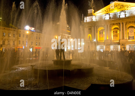 Lviv, Ukraine, youth dip in the fountain in front of the Opera Stock Photo