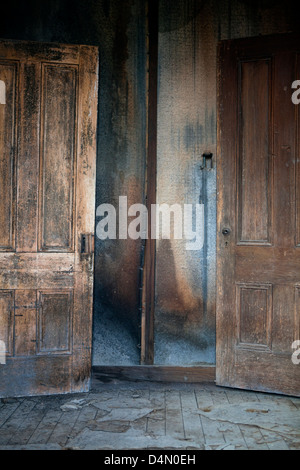 Two doors in an old abandoned house in the ghost town of Bodie, California, USA Stock Photo