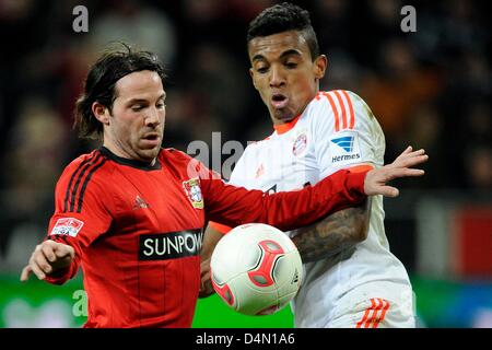 Munich's Luiz Gustavo (R) vies for the ball with Leverkusen's Gonzalo Castro (L) during the German Bundesliga soccer match between Bayer Leverkusen and FC Bayern Munich at  BayArena in Leverkusen, Germany, 16 March 2013. Photo: MARIUS BECKER (ATTENTION: EMBARGO CONDITIONS! The DFL permits the further utilisation of up to 15 pictures only (no sequential pictures or video-similar series of pictures allowed) via the internet and online media during the match (including halftime), taken from inside the stadium and/or prior to the start of the match. The DFL permits the unrestricted transmission of