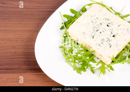Blue cheese on white plate Stock Photo
