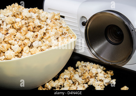 Home Cinema projector with fresh made Popcorn Stock Photo