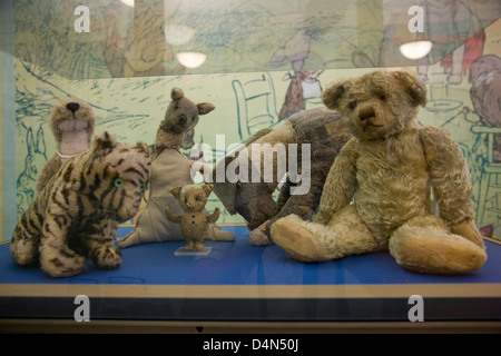 The original Winne the Pooh stuffed toy animals in a glass display case in New York Public Library Stock Photo